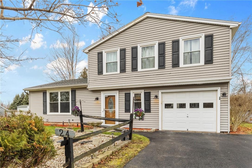 view of front of property with a garage