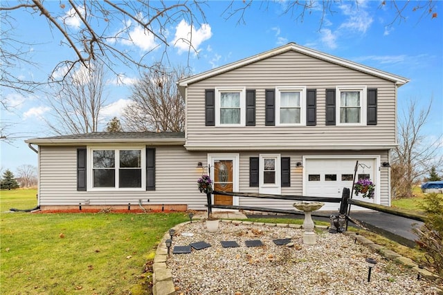 view of front of home with a garage and a front yard