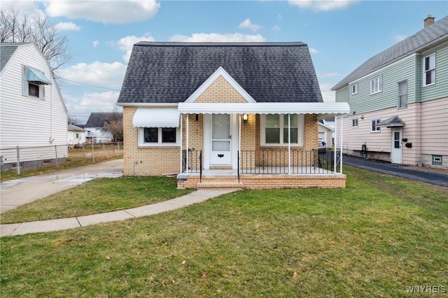 bungalow-style home with a front yard