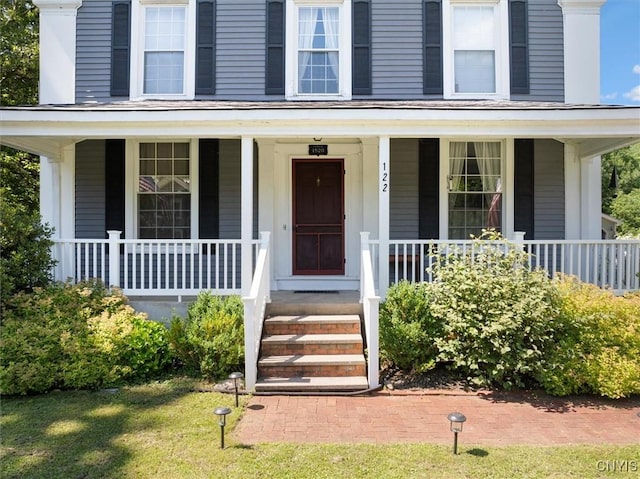 doorway to property with a porch