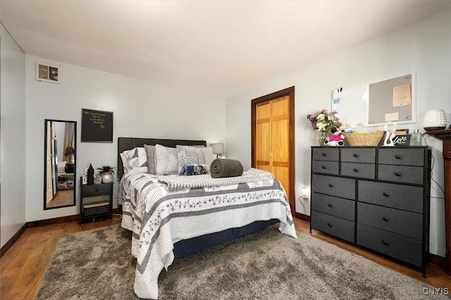 bedroom featuring hardwood / wood-style floors