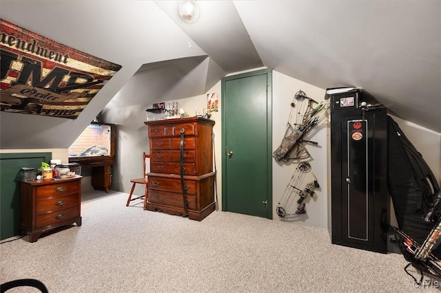 interior space featuring light colored carpet and lofted ceiling