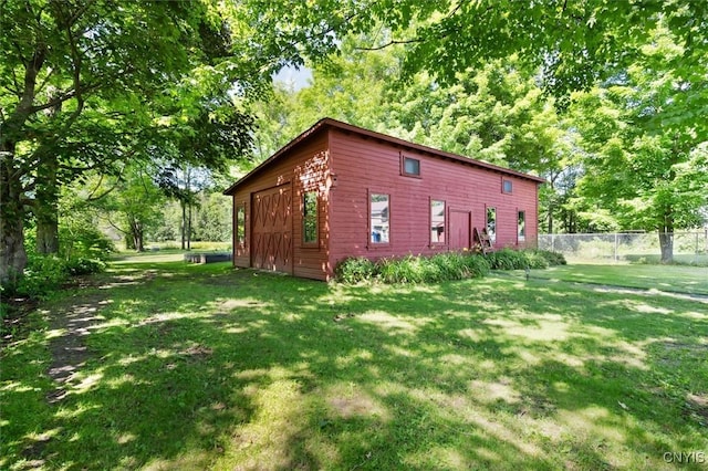 view of side of home featuring a yard