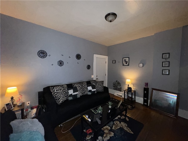 living room with dark hardwood / wood-style floors