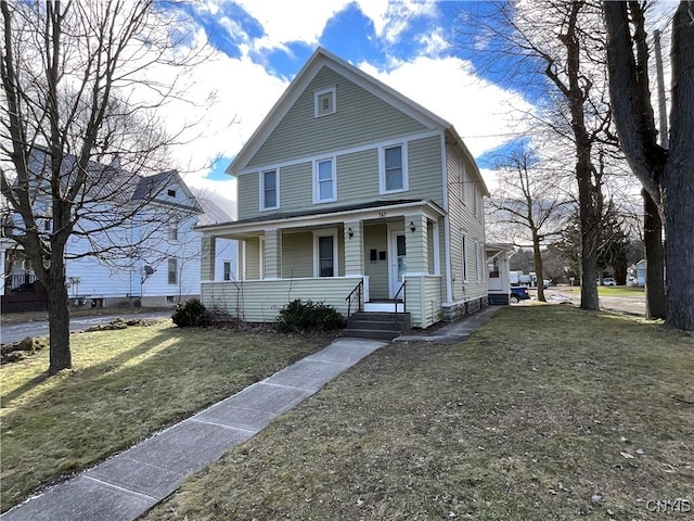 view of front facade featuring a front lawn and covered porch