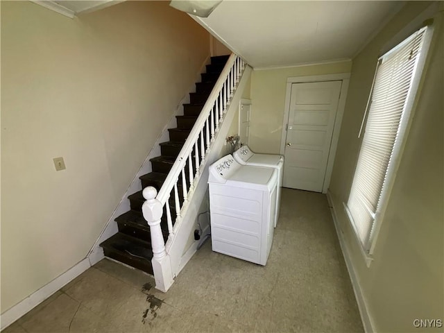 laundry area with washing machine and clothes dryer