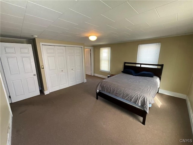 carpeted bedroom featuring a closet