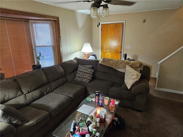 carpeted living room featuring ceiling fan