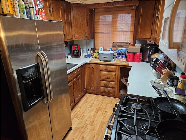 kitchen featuring light hardwood / wood-style floors and stainless steel refrigerator with ice dispenser