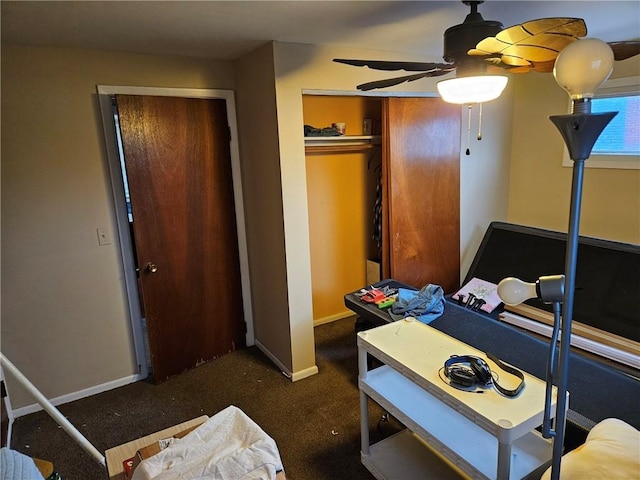 carpeted bedroom featuring ceiling fan and a closet