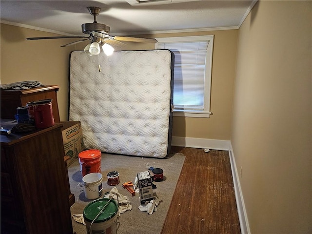 dining space featuring hardwood / wood-style floors, ceiling fan, and crown molding