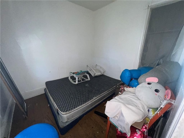 bedroom featuring dark hardwood / wood-style flooring