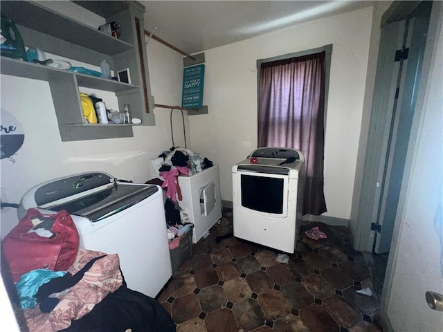 laundry area with independent washer and dryer