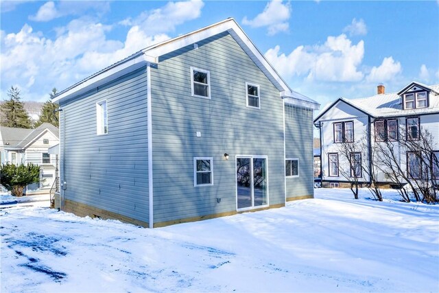 view of snow covered house