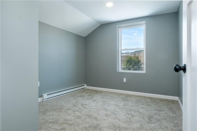 additional living space featuring light carpet, a baseboard radiator, and vaulted ceiling