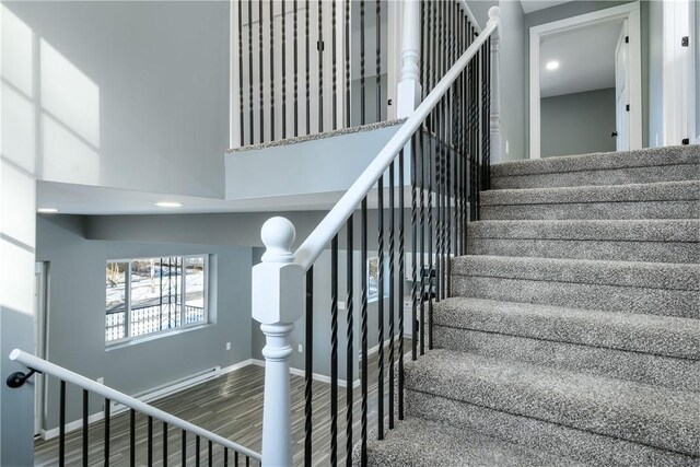 stairway featuring hardwood / wood-style floors