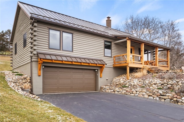 log cabin featuring a garage