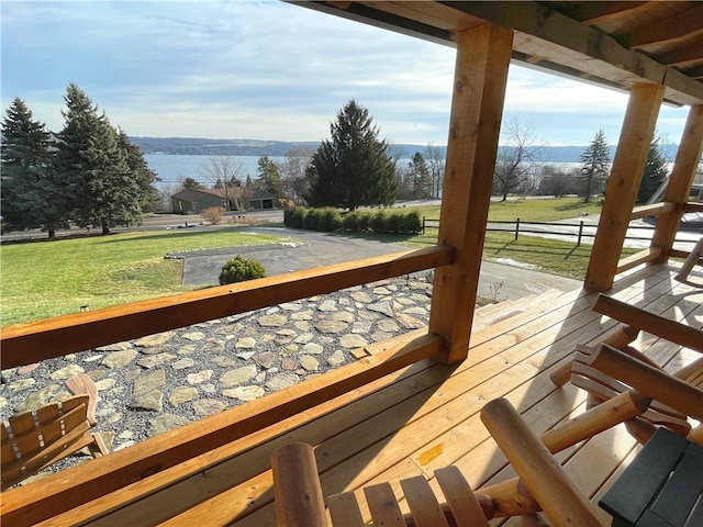 wooden deck with a lawn