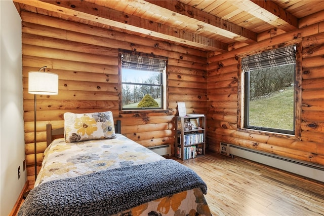 bedroom featuring wooden ceiling, light wood-type flooring, log walls, a baseboard radiator, and beamed ceiling