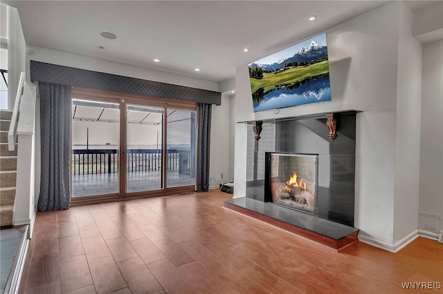 unfurnished living room with hardwood / wood-style floors