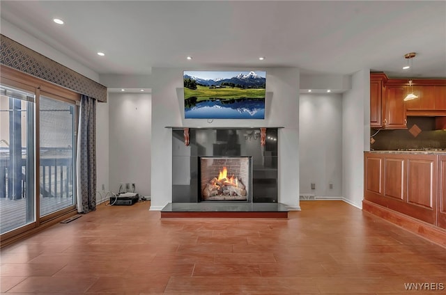 unfurnished living room featuring light hardwood / wood-style floors