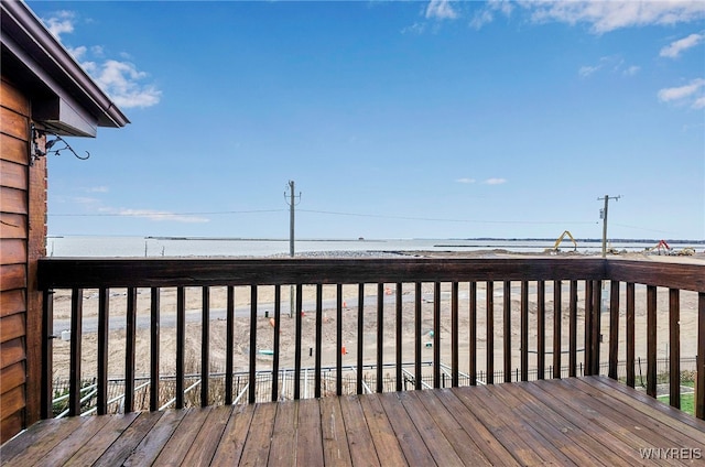 wooden terrace with a water view