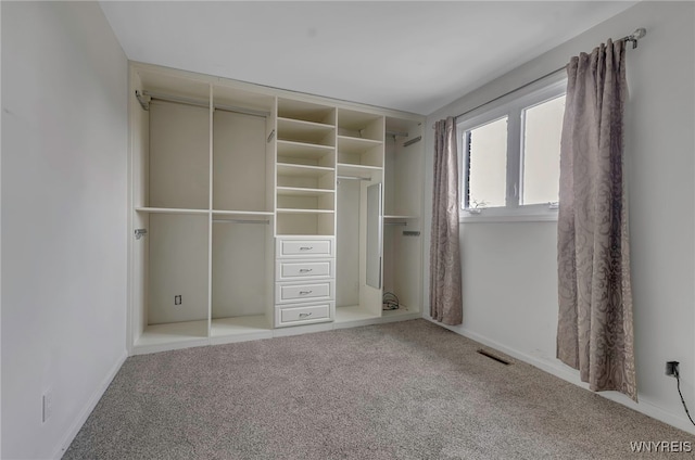 unfurnished bedroom featuring a closet and carpet flooring