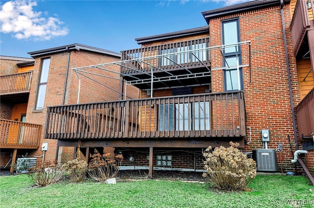 back of house featuring central AC