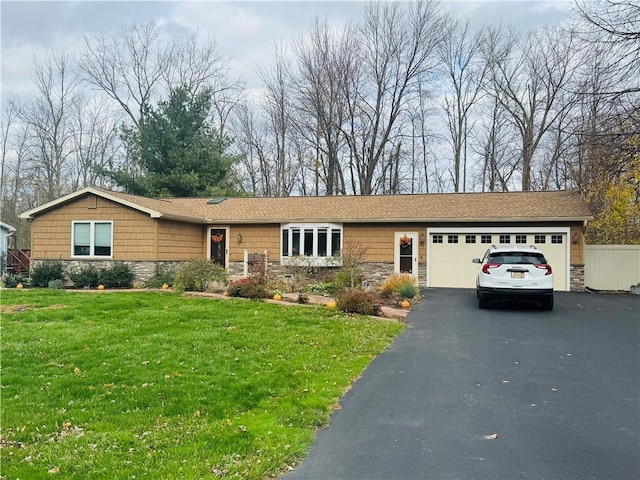 single story home with a front lawn and a garage