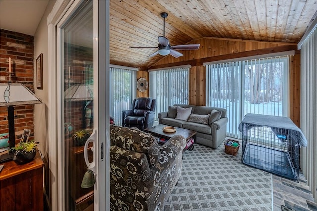 sunroom / solarium with vaulted ceiling, wooden ceiling, and ceiling fan