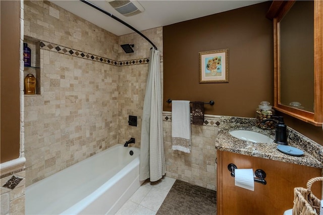 bathroom featuring tile walls, vanity, tile patterned floors, and shower / bath combination with curtain