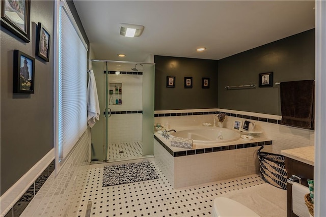 bathroom featuring vanity, separate shower and tub, and tile patterned floors