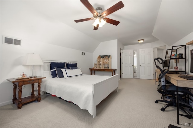 bedroom featuring ceiling fan, light carpet, and vaulted ceiling