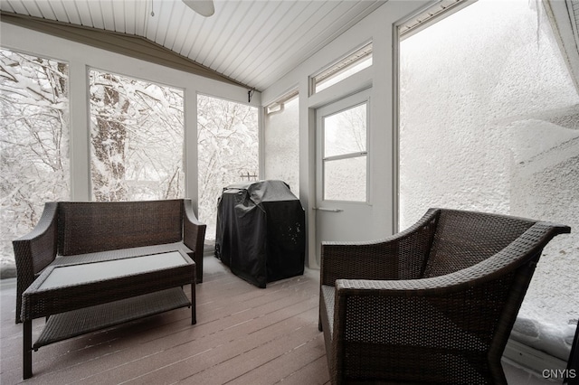 sunroom / solarium featuring vaulted ceiling and ceiling fan