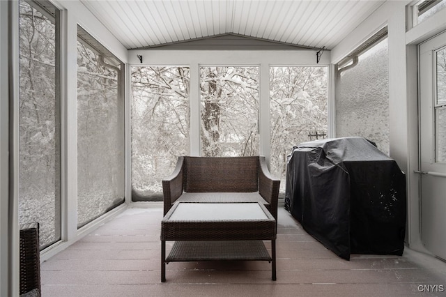 sunroom / solarium with lofted ceiling