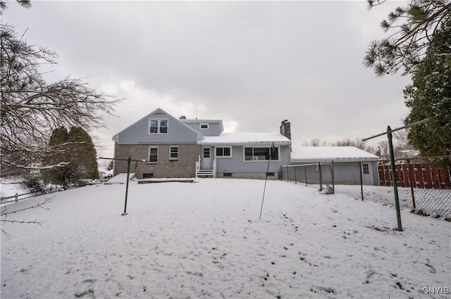 view of snow covered house