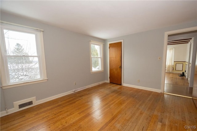 unfurnished bedroom with hardwood / wood-style flooring