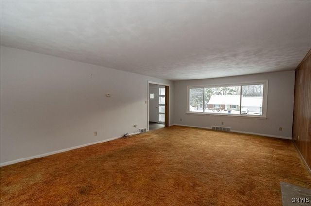 unfurnished room with carpet flooring