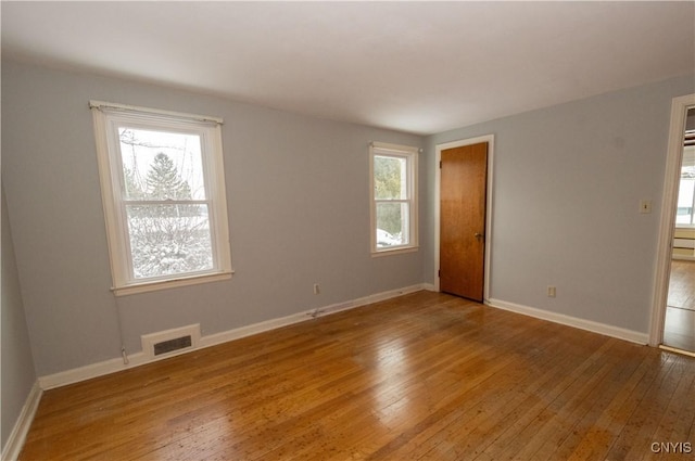 empty room featuring hardwood / wood-style floors