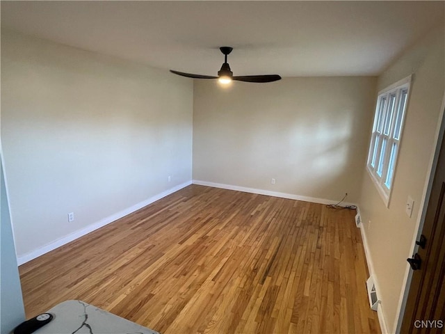 empty room featuring ceiling fan and wood-type flooring