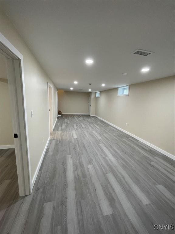 basement with dark wood-type flooring