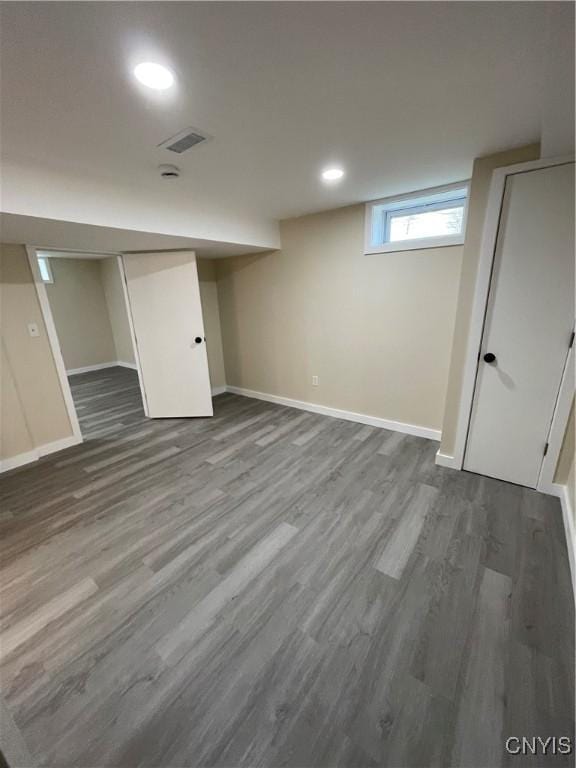 basement featuring wood-type flooring