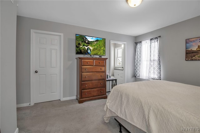 bedroom featuring light colored carpet