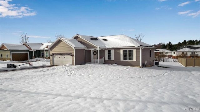 view of front of property with a garage and cooling unit