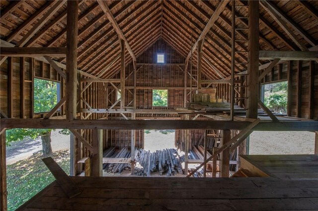 misc room with lofted ceiling with beams and wood ceiling