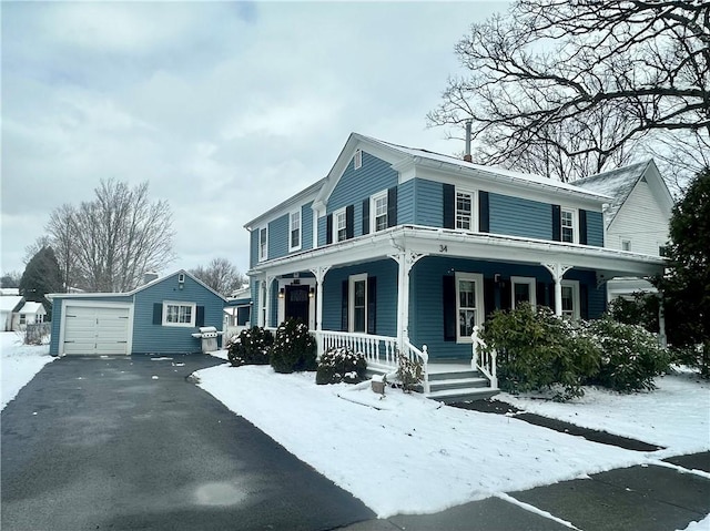 view of front facade featuring an outdoor structure and a garage