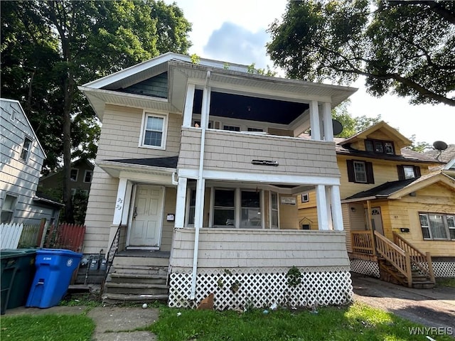 view of front of house with a balcony