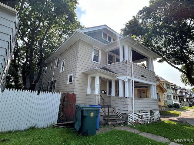 view of front of home with a balcony