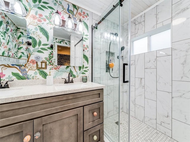 bathroom featuring vanity, walk in shower, and ornamental molding