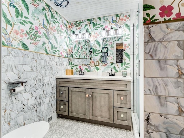 bathroom featuring tile patterned flooring, vanity, and toilet